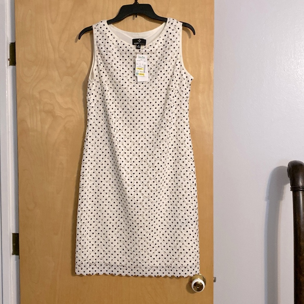 A beautiful Ronni Nicole lined white dress with black polkadots.